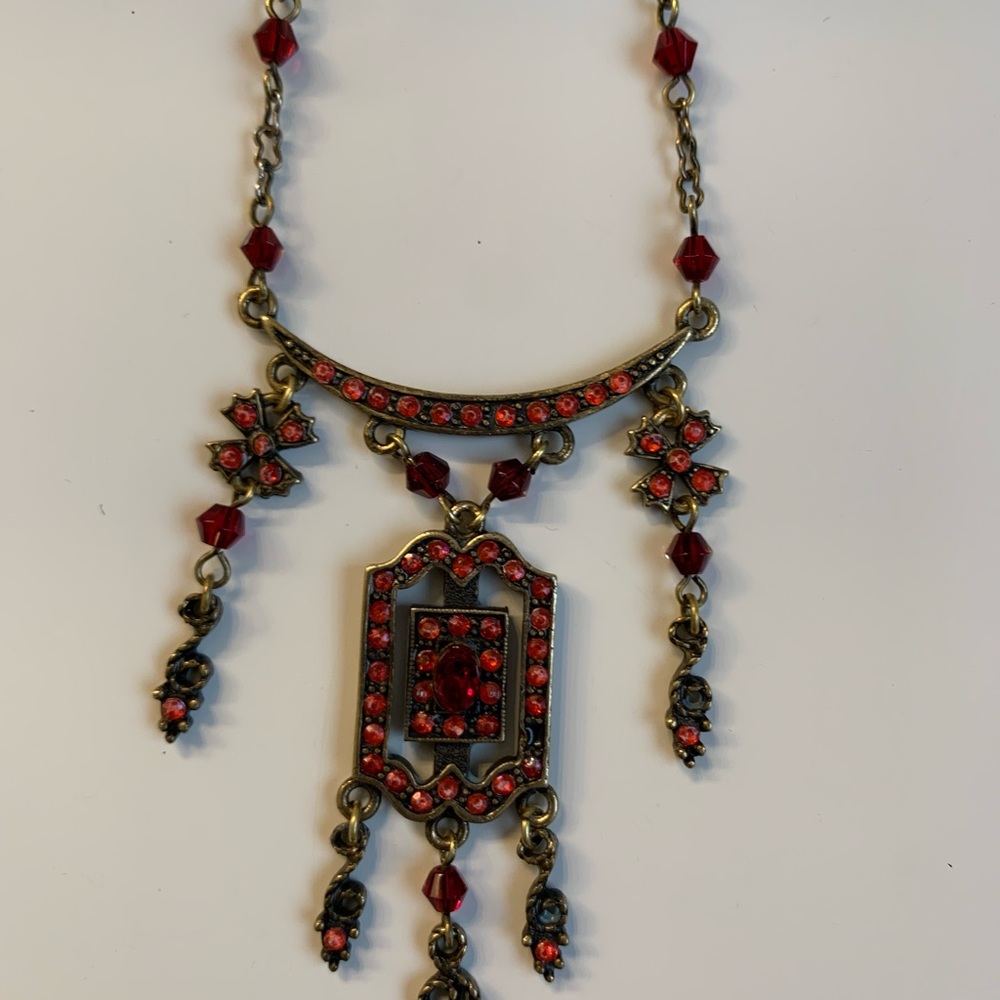 Vintage necklace & earrings. 19” from clasp to closure. Red stones. Bronzed